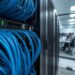 ภาพตู้ Rack Server ที่มีการจัดเก็บสายแลน CAT6 เข้า Patch Panel อย่างเป็นระเบียบ สวยงาม แสดงถึงมาตรฐานงานบริการรับเดินสายแลนสำหรับออฟฟิศ